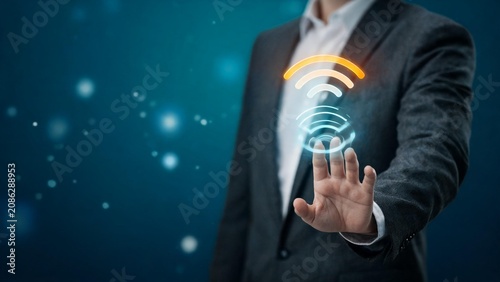 Businessman holding glowing wifi symbol in hand representing wireless connectivity and digital technology