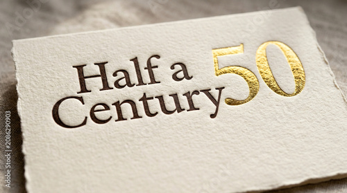 Elegant 50th birthday card with gold foil text, half a century anniversary greeting on textured paper, luxury golden 50th celebration invitation