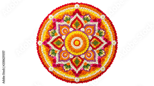 Traditional flower rangoli mandala pookalam decoration made of marigolds, roses, and jasmine petals isolated on a transparent background