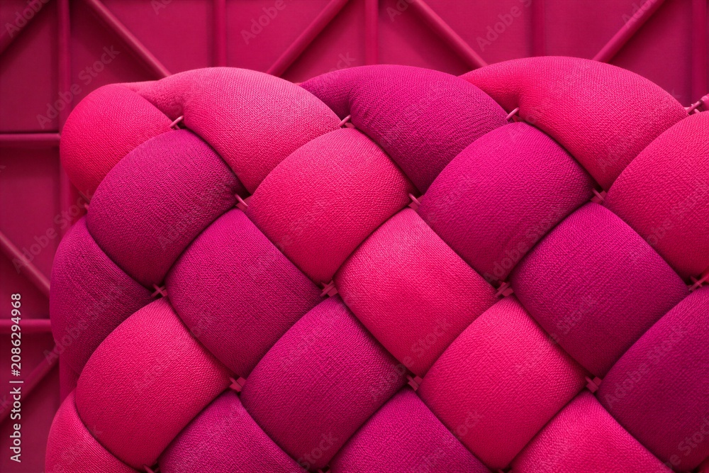 Fototapeta premium Vibrant pink tufted fabric in geometric pattern. Rich textures contrast against structured background. Modern design evokes luxury and bold fashion. Ideal for interiors, branding, or lifestyle visuals