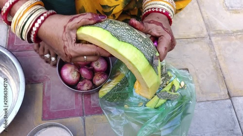 a woman cutting wax gourd for food