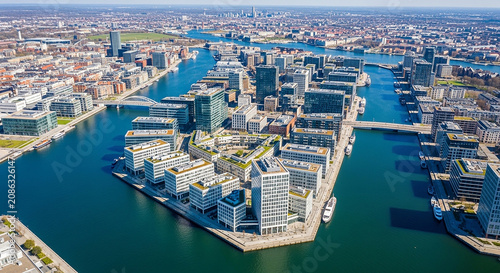 Aerial view of modern city waterfront with glass office buildings and canal