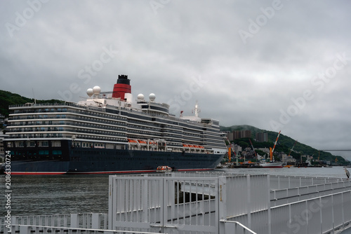 Schilderij op canvas Classic luxury cruiseship cruise ship liner Queen Elizabeth docked in Nagasaki,
