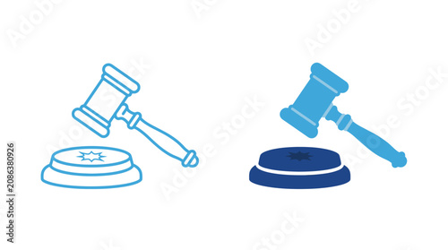 фотографія Two gavels and sound blocks sit on a table in courtroom setting.