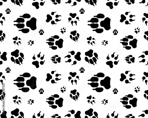 Seamless pattern of print of various dogs paws on a white background	