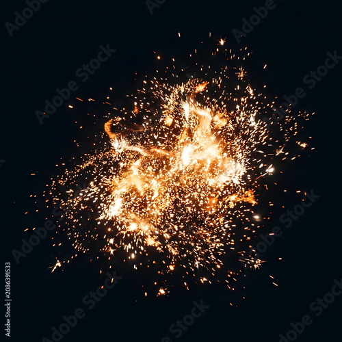 Explosive fireworks burst in vibrant night sky.