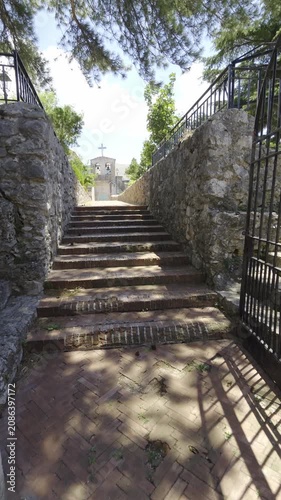 Entrance to a public garden and access path to a panoramic terrace in Collianello, Italy.