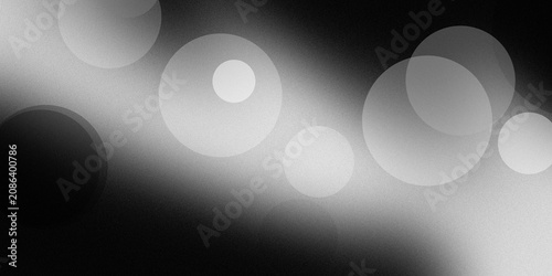 Foto Abstract background featuring circular light bokeh elements and soft gradients in a monochromatic black and white color scheme design