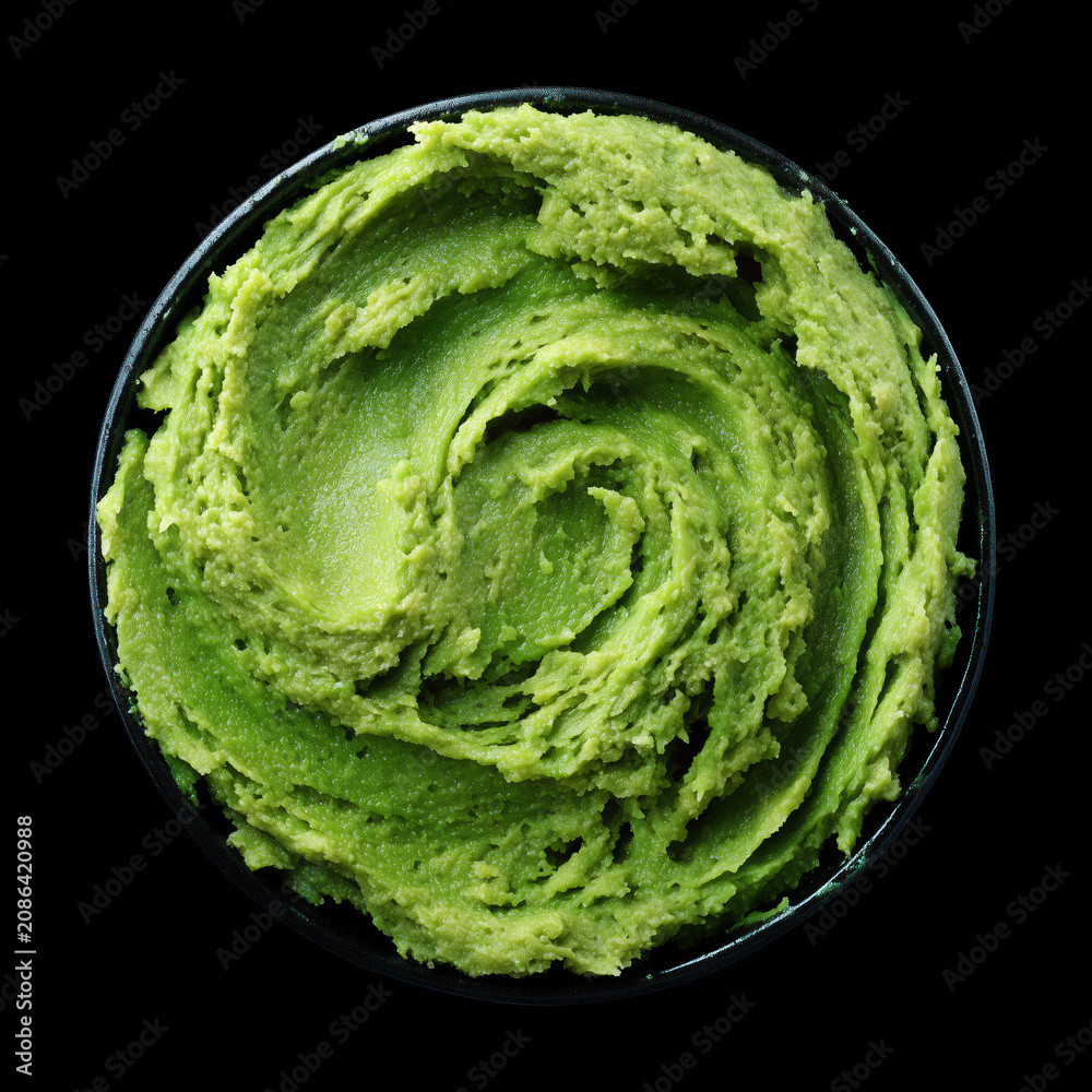 Obraz premium Spicy wasabi paste for sushi isolated on black background with clipping path, concept of condiments and seasoning