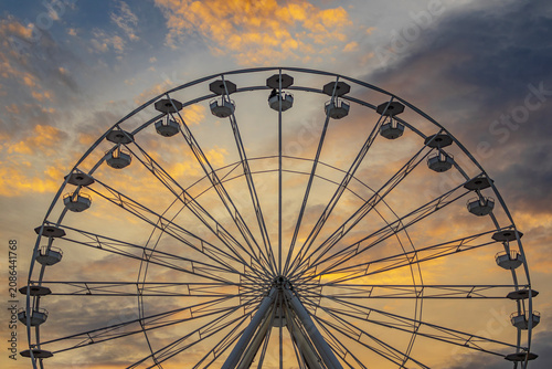 A large Ferris wheel against a beautiful sunset sky in Sunny Beach, Burgas, Bulgaria
