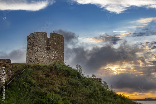 Old ruined stone windmill in Nessebar, Burgas, Bulgaria at sunset