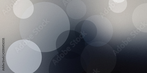 Bild auf Leinwand Abstract background featuring soft circular bokeh shapes with grey tones and grainy texture for professional photography usage