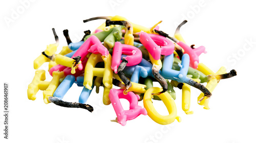 Foto Pile of colorful alphabet letter candles with burnt wicks