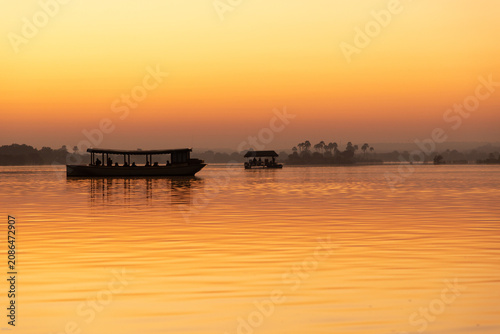 Принти на полотні vintage boast on the Zambezi River at sunrise, Zimbabwe, Africa