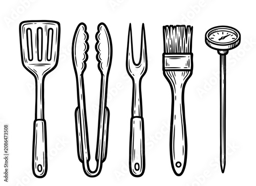 фотографія Barbecue utensil set with spatula, tongs, carving fork, basting brush and thermo
