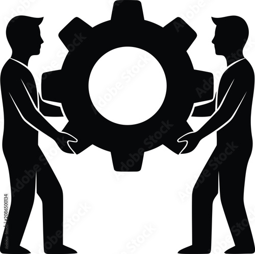 Two People Working Together Holding A Large Industrial Metal Gear