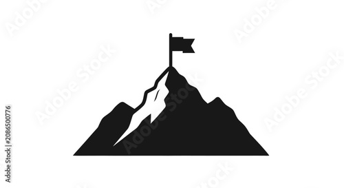 Mountain peak displays a triumphant flag placed at the summit to symbolize success and achievement.