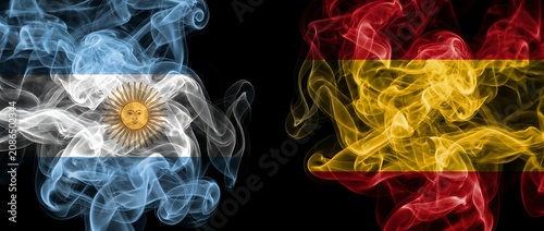 Argentinian flag smoke versus Spanish flag smoke on black background, symbolic representation of national pride, cultural relations and friendship.