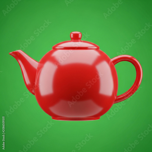 Red teapot on green background