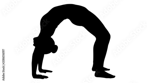 Fotografie Acrobat executes a deep backbend wheel pose to show advanced athletic capability and spinal mobility