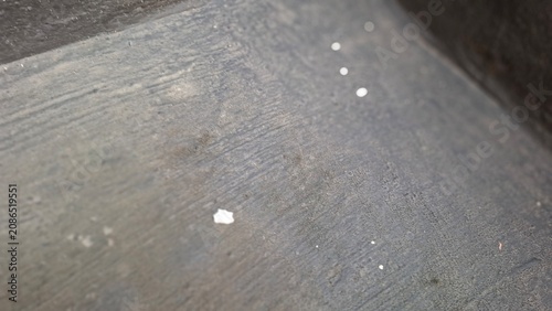 Dark grey concrete floor with subtle texture