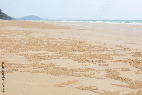Seascape Sand Crab Patterns Background with Blur Bokeh Calm Sea.