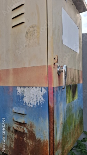 Old rusted electrical utility cabinet close up