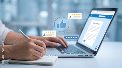 Customer feedback and online review concept with person taking notes while using laptop for business