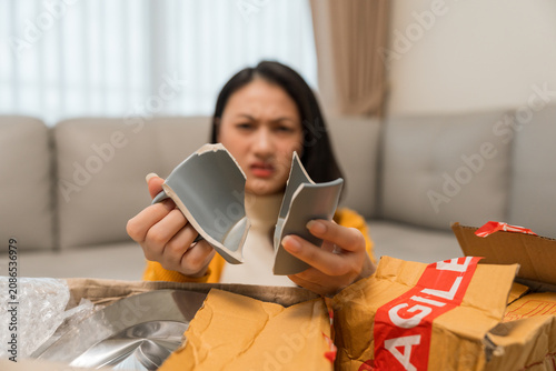 Asian women ordered household items plates and ceramic cups online. The packages arrived damaged dented and broken. Online shopping packages damaged due to the shipping system require a claim.