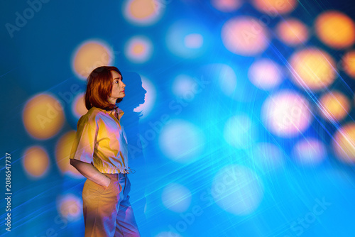 Woman explores surreal augmented reality concept indoors