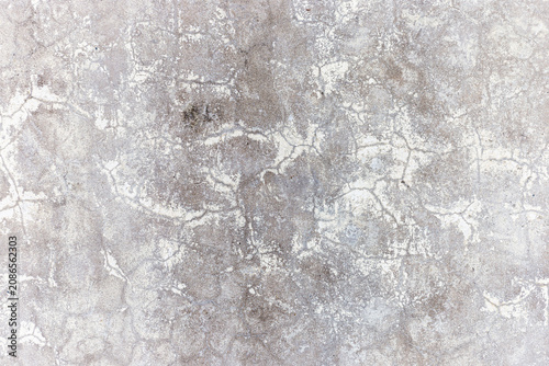 Fotografía Close up texture of an old weathered concrete wall with a network of fine superficial cracks