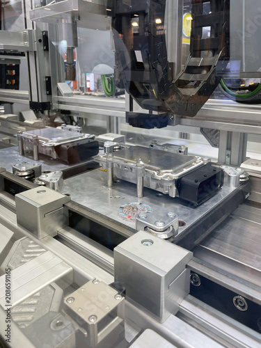Close-up of conveyor line for assembling electronic modules for manufacturing process equipment.
