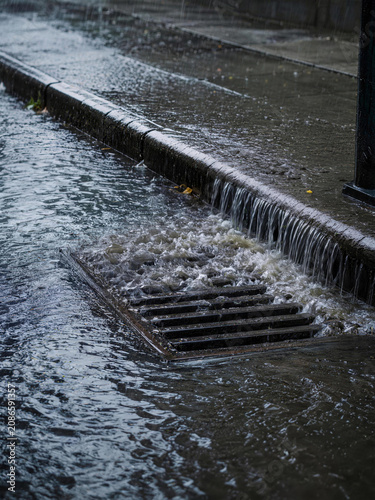Storm Drain Overflowing During Heavy Rain and Urban Flooding