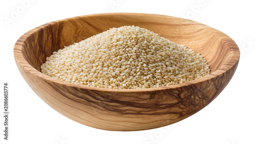 Wooden bowl filled with white sesame seeds