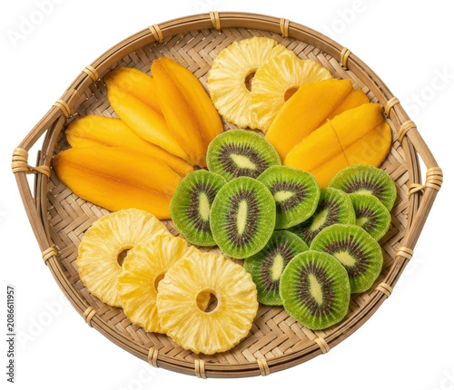 Dried tropical fruit slices with mango kiwi and pineapple over transparent background