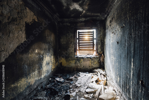 Aftermath of fire or air strike. Burnt domestic room interior