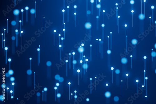 Small blue lights fall in a pattern against a dark blue background during a digital art display at an event