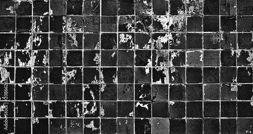 Abstract black background. Swimming pool water surface with grunge mosaic tiles.	