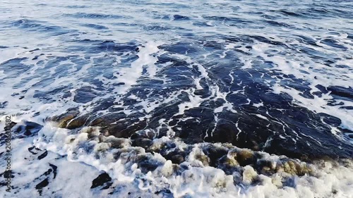 Cinematic View of Crashing Ocean Waves and White Sea Foam Textures