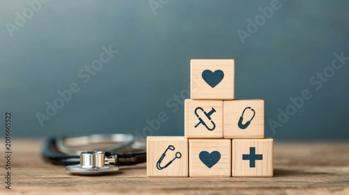 pyramid of health and medical icon on wooden cube with copy space for health insurance