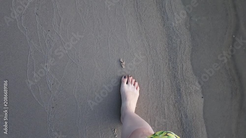 POV First-Person View of Barefoot Woman Walking on Sandy Beach
