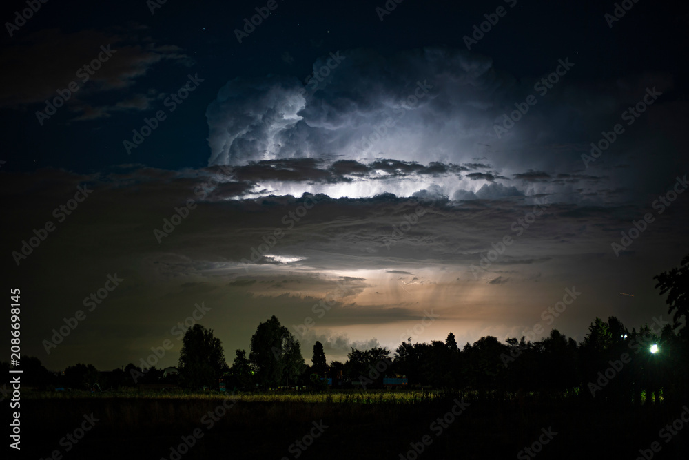 Obraz premium Lightnings thunderstorm clouds night