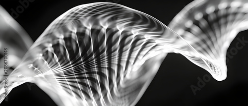 Black and white abstract wave resembling a DNA helix made of glowing lines on a dark background with bokeh effect.