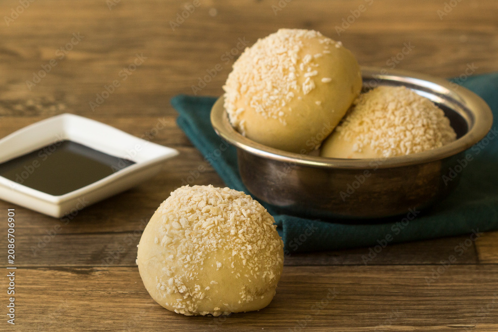 Fototapeta premium Fried Sesame Seed Balls with Soy Sauce Ramekin