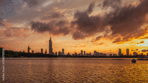 Photography Nanjing city skyline with Zifeng Tower at sunset, Xuanwu Lake golden lake view d