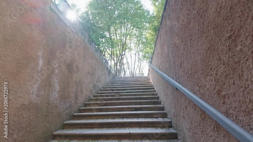 Stone Staircase Leading to Tree-Lined Exit in Rome, Italy
