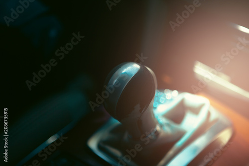 Close up of a gear stick in a car.