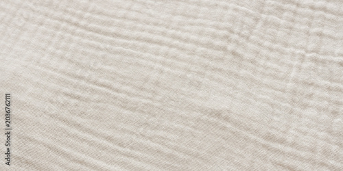 Картината върху платно Top view close up of soft crinkled beige muslin fabric texture