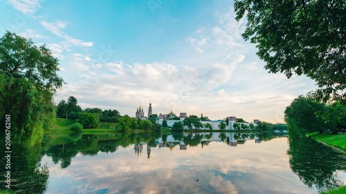 A timelapse of rapidly moving clouds in the sky at sunset over the Novodevichy Convent in Moscow
