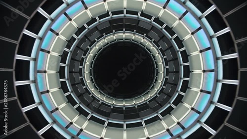 Advancing frames moving concentric rings and panes inside shaft void, shifting color, creating flow